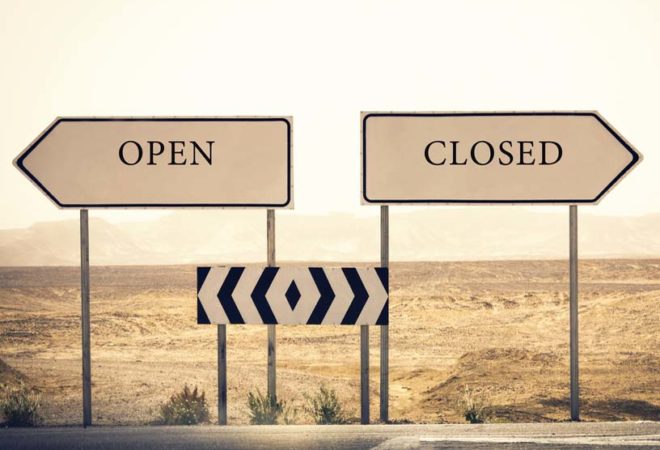 open and closed signs on highway